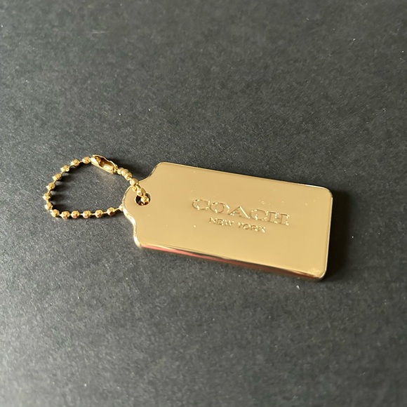Coach Accessories - Coach gold dog tag keychain